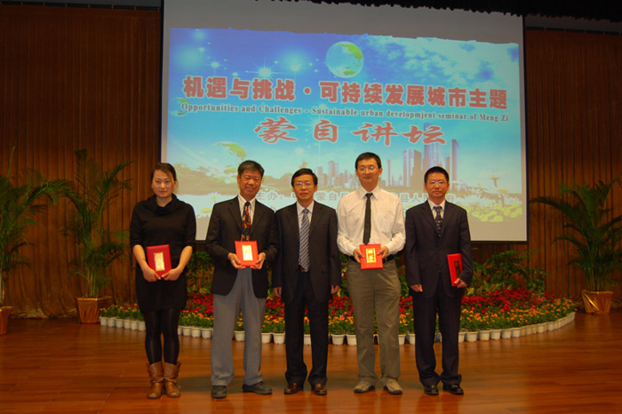 Speakers receiving honoury metal from Country Magistrate